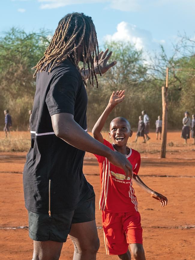 Naitanui sharing his time, and love of footy, with the kids. (Picture: Nick Ralph)