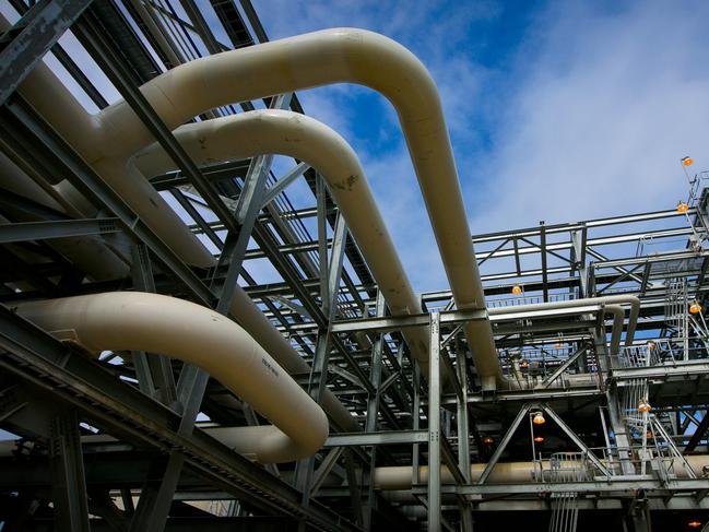 Gas pipes run through a plant at the Queensland Curtis Liquefied Natural Gas (QCLNG) project site, operated by QGC Pty, a unit of Royal Dutch Shell Plc, in Gladstone, Australia, on Wednesday, June 15, 2016. Gas from more than 2,500 wells travels hundreds of miles by pipeline to the project, where it's chilled and pumped into 10-story-high tanks before being loaded onto massive ships. Photographer: Patrick Hamilton/Bloomberg