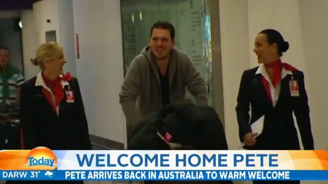 Pete Stefanovic arrives, escorted by Qantas staff.