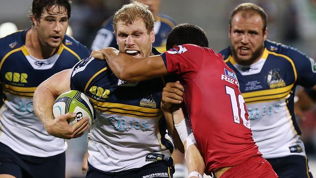 CANBERRA, AUSTRALIA - FEBRUARY 13: David Pocock of the Brumbies is tackled during the round one Super Rugby match between the Brumbies and the Reds at GIO Stadium on February 13, 2015 in Canberra, Australia. (Photo by Stefan Postles/Getty Images)