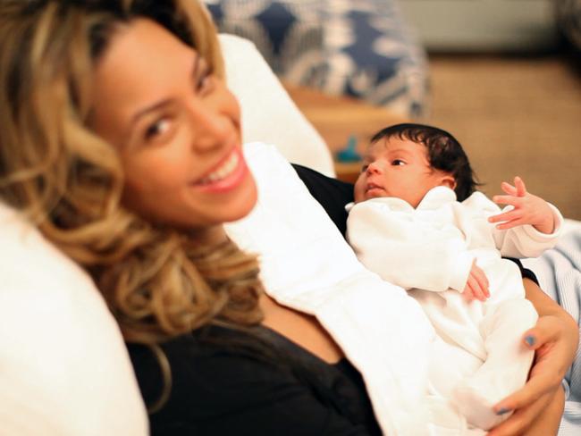 Beyoncé is all smiles as she reveals her first daughter to the world, Blue Ivy. Picture: Ed Burke/The Carter Family/AP