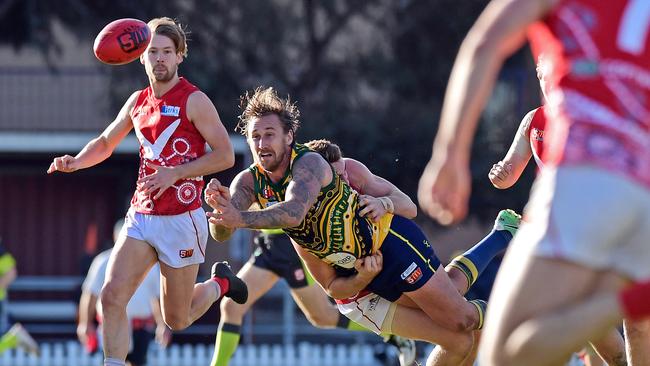 Eagles veteran Scott Lewis gets a handpass away against North Adelaide. Picture: Tom Huntley.