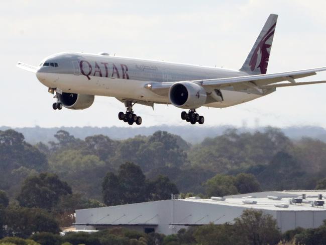 A Qatar Airways aircraft arrives with passengers from Italian cruise liners at Perth International airport in Perth, Monday, March 30, 2020. About 270 Australians are on board the flight, including 120 West Australians. No passengers with coronavirus symptoms were allowed to board.(AAP Image/Richard Wainwright) NO ARCHIVING