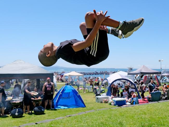 Amiir, 10, performs a flip at the beach. Picture: Mark Wilson