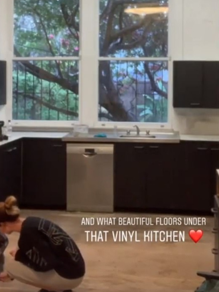 Ms Broadhurst working on the floor toward the end of the kitchen's renovation. Picture: Instagram