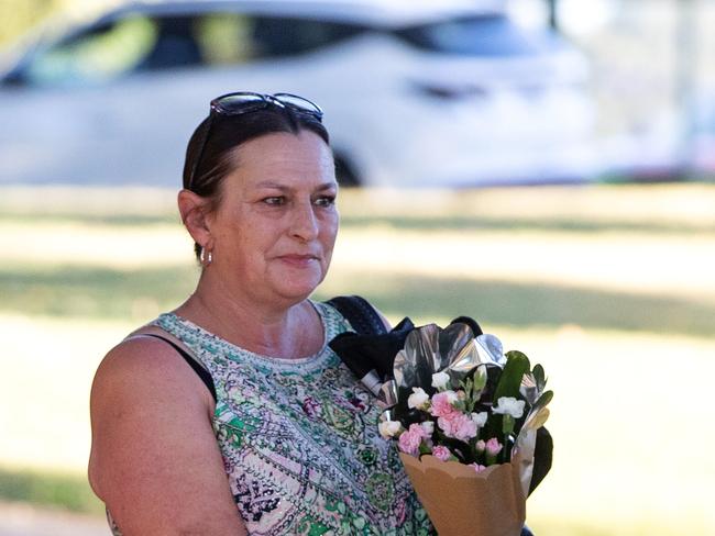 Locals bring flowers. Picture: Mark Stewart