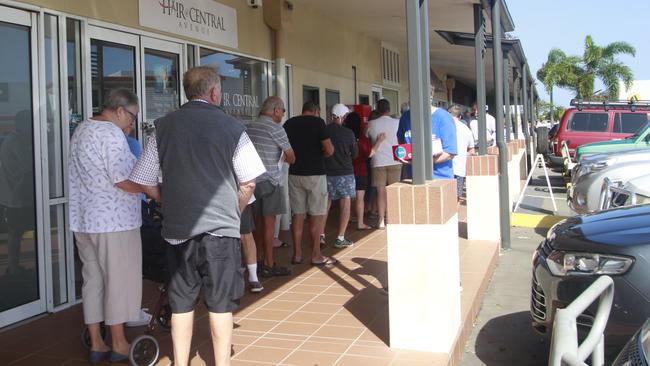 People line up for pre-polling at a shopping centre at Hervey Bay.