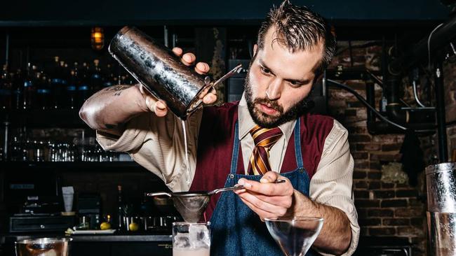 Bartender EJ Psilas makes a cocktail at Green Russell, a Bonanno Concepts bar in Denver. Picture: Wall Street Journal