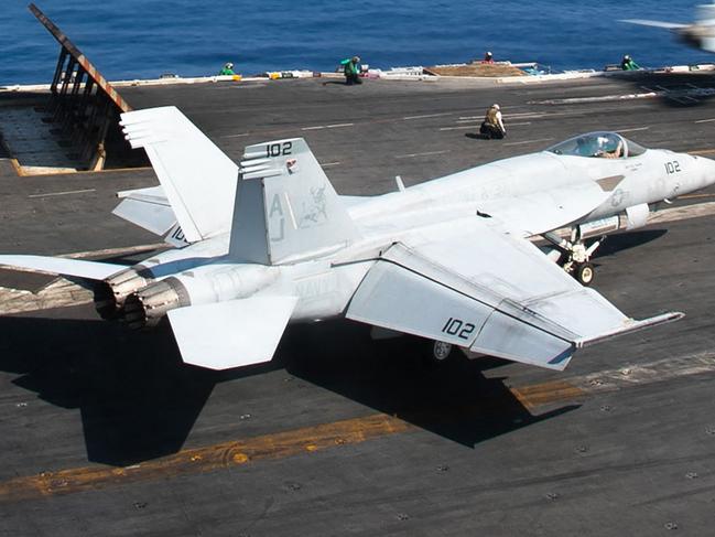 This handout picture courtesy of the US Navy released on October 15, 2203 shows an F/A-18E Super Hornet attached to the "Ragin' Bulls" of Strike Fighter Squadron (VFA) 37 launching from the flight deck of the world's largest aircraft carrier USS Gerald R. Ford (CVN) 78 in the Eastern Mediterranean Sea, October 12, 2023. The United States said October 15, 2023 it fears an escalation of the war between Israel and Hamas and the prospect of Iran getting directly involved. In the eastern Mediterranean the carrier USS Eisenhower and its accompanying ships will join the USS Gerald R. Ford, which was dispatched after the Hamas attack on October 7. (Photo by Jackson ADKINS / US NAVY / AFP) / RESTRICTED TO EDITORIAL USE - MANDATORY CREDIT "AFP PHOTO / US NAVY / Mass Communication Specialist 2nd Class Jackson Adkins" - NO MARKETING NO ADVERTISING CAMPAIGNS - DISTRIBUTED AS A SERVICE TO CLIENTS