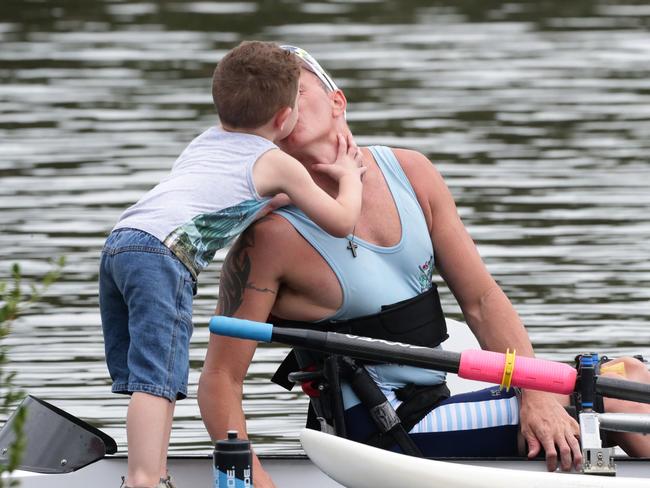 Erik Horrie gives his son a kiss before setting off at the Australian Open Rowing Championships.