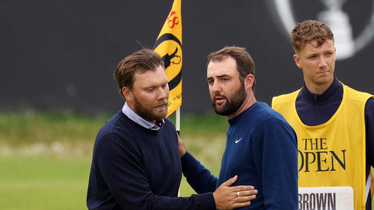 TROON, SCOTLAND – JULY 21: Daniel Brown of England interacts with Scottie Scheffler of the United States on the 18th green during day four of The 152nd Open championship at Royal Troon on July 21, 2024 in Troon, Scotland. (Photo by Kevin C. Cox/Getty Images)