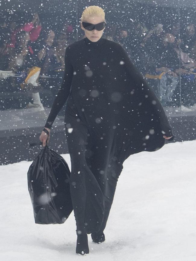 The models clutched leather sacks resembling garbage bags.