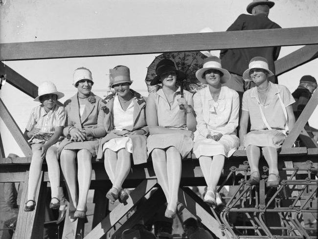 Women wait at Trentham racecourse, New Zealand, for John Moncrieff and George Hood to land.