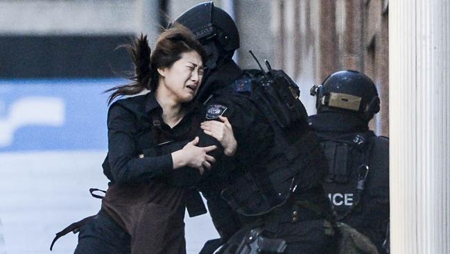 Police attend a siege in the Lindt shop in Sydney's Martin Place. Photos: Chris McKeen