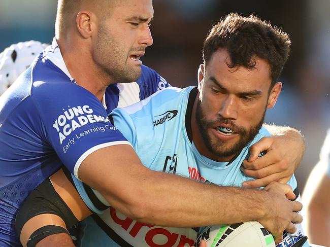 SYDNEY, AUSTRALIA - MARCH 15: Toby Rudolf of the Sharks is tackled during the round two NRL match between Cronulla Sharks and Canterbury Bulldogs at PointsBet Stadium on March 15, 2024, in Sydney, Australia. (Photo by Mark Metcalfe/Getty Images)