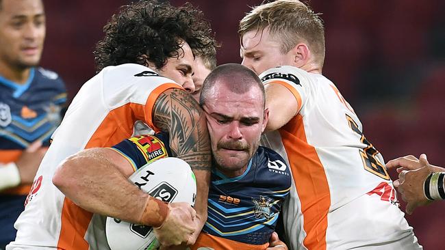 Keegan Hipgrave of the Titans takes the ball up during the Round 4 NRL match between the Gold Coast Titans and the Wests Tigers at Suncorp Stadium in Brisbane, Sunday, June 7, 2020. (AAP Image/Dan Peled) NO ARCHIVING, EDITORIAL USE ONLY