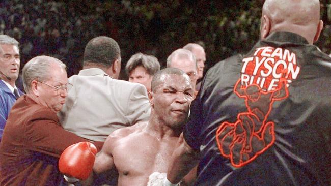 Mike Tyson reacts after biting Holyfield. Picture: AP/Mark J. Terrill