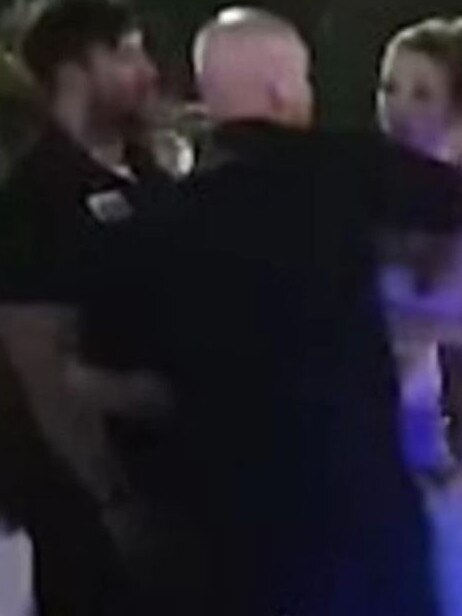 A screenshot of a video of security guards at The Grand Hotel Labrador in a confrontation with two patrons, who were pushed down a flight of stairs.