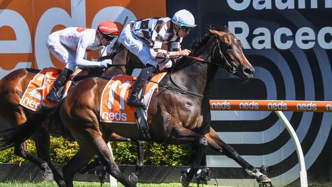 Magic Time surges past I Am Me to win the Group 1 Sir Rupert Clarke Stakes at Caulfield. Picture: Pat Scala/Racing Photos via Getty Images