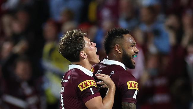 Hamiso Tabuai-Fidow of the Maroons celebrates with Reece Walsh.