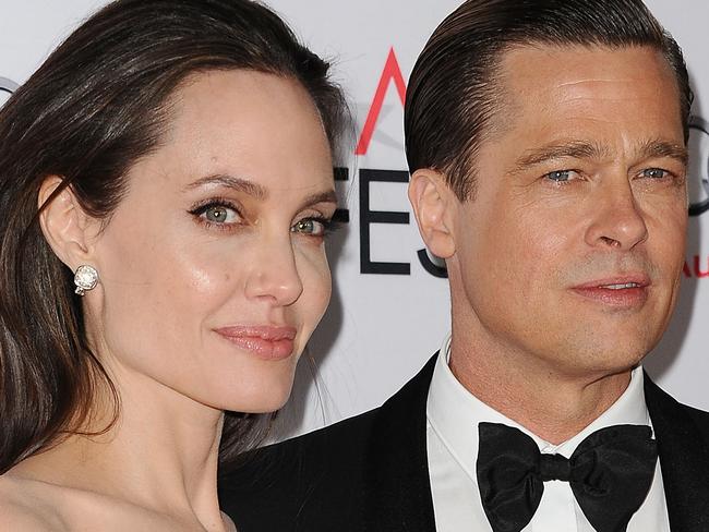 HOLLYWOOD, CA - NOVEMBER 05:  Angelina Jolie and Brad Pitt attend the premiere of 