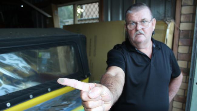 Caboolture resident John Lemon points the finger at Moreton Bay Regional Council after he claims his house was covered in dust.