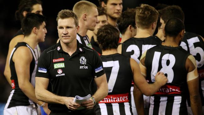 AFL Round 17 - Western Bulldogs v Collingwood at Etihad Stadium, Coach Nathan Buckley leaves the 3/4 time huddle. Melbourne. 26th July 2015. Picture: Colleen Petch.