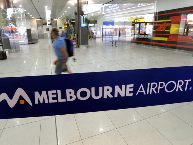 Passengers make their way through the Virgin Terminal at Melbourne Airport in Melbourne, Wednesday, April 23, 2014. (AAP Image/Julian Smith) NO ARCHIVING