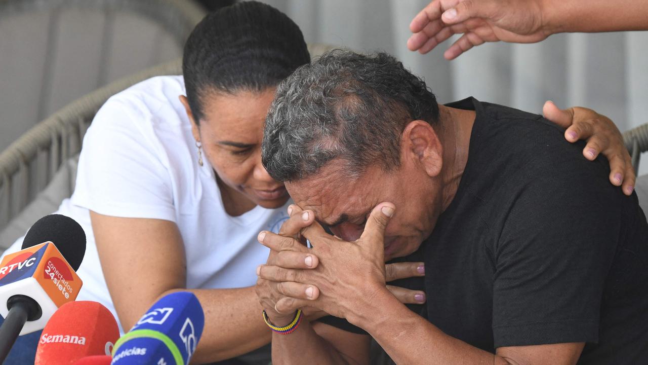 Luis Manuel Diaz, father of Liverpool's forward Luis Diaz, is consoled by his wife Cilenis Marulanda during a press conference at his house in Barrancas, Colombia on November 10, 2023. Colombia's ELN guerrilla group on Thursday freed the father of Liverpool footballer Luis Diaz, ending a 12-day kidnapping ordeal and triggering celebration in his hometown. After days of negotiations for the handover, the rebels presented Luis Manuel Diaz to humanitarian workers at an undisclosed location in the Serrania del Perija mountain range on the border with Venezuela. (Photo by Daniel Munoz / AFP)