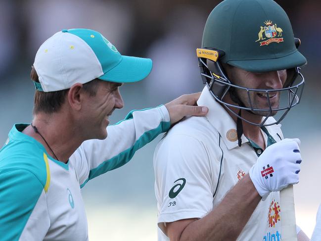 ADELAIDE, AUSTRALIA - DECEMBER 19: Joe Burns of Australia is congratulated by Justin Langer, coach of Australia, after winning the match day three of the First Test match between Australia and India at Adelaide Oval on December 19, 2020 in Adelaide, Australia. (Photo by Daniel Kalisz/Getty Images)