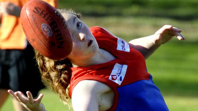 Emily Smith playing junior football for St Albans.