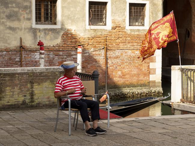 A gondolier waits for a fare.