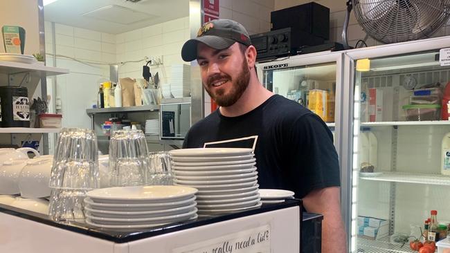 Marcus Cutler back working in his parents cafe at Manly after his big day out at Randwick rugby. Pic: Supplied