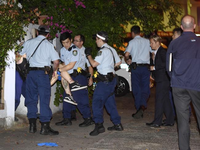 Police found Amati in a nearby front yard feigning unconsciousness and carried her out to the street. Picture: Gordon McComiskie 