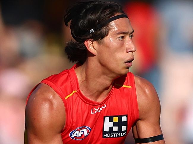 GOLD COAST, AUSTRALIA - AUGUST 17: Alex Davies of the Suns kicks during the round 23 AFL match between Gold Coast Suns and Melbourne Demons at People First Stadium, on August 17, 2024, in Gold Coast, Australia. (Photo by Chris Hyde/Getty Images)