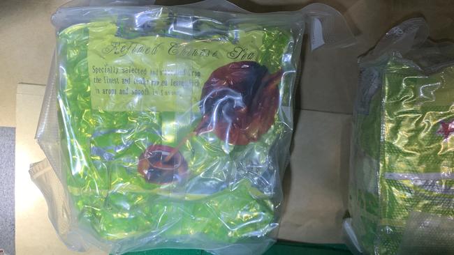 The drugs were allegedly found vacuum-sealed in green shopping bags within a hidden compartment of the car. Picture: NSW Police.