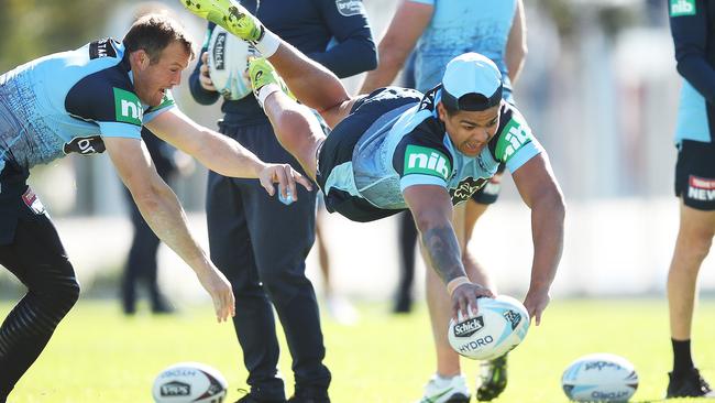 Latrell Mitchell dives for during NSW State of Origin training this week. Picture: Phil Hillyard