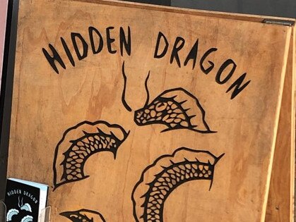 A sign for Hidden Dragon Massage in Lawrence St, Freshwater. One of its employees was convicted for sexually touching a female client.