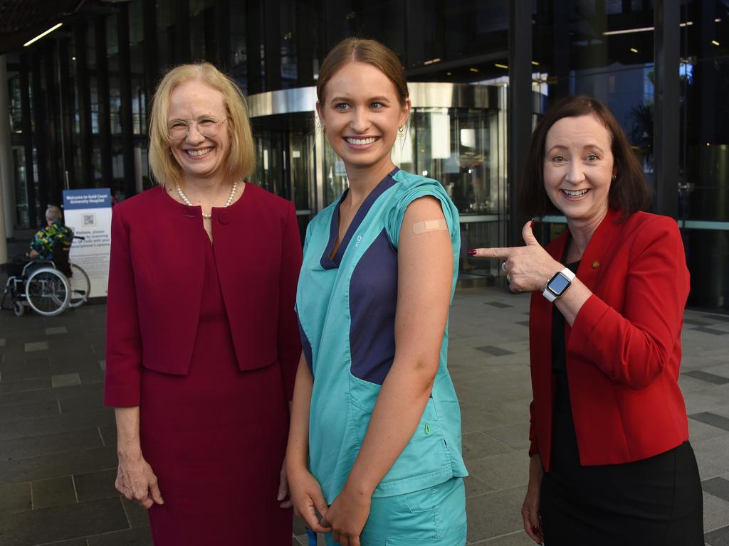 Chief health officer Jeannette Young (left) and Health Minister Yvette D’Ath (right) said Monday was a ‘historic moment’ in the fight against COVID-19 as registered nurse Zoe Park received the first COVID-19 jab. Picture: NCA NewsWire / Steve Holland