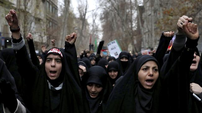 Protesters take to the streets in Tehran on Saturday. Picture: AP