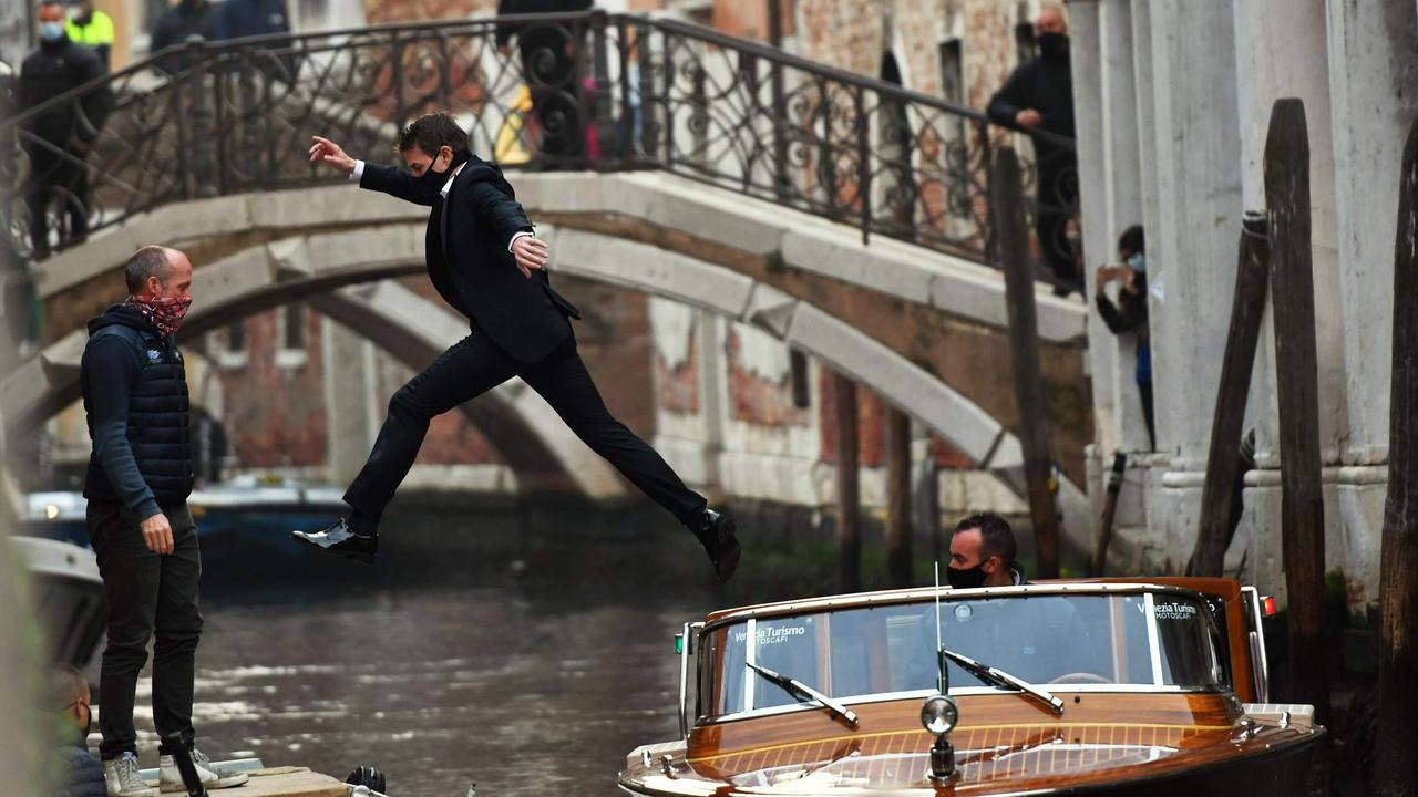 Tom Cruise jumps between two taxiboats during the shooting of Mission Impossible: Lybra in Venice on October 20, 2020. Picture: Marco Sabadin / AFP