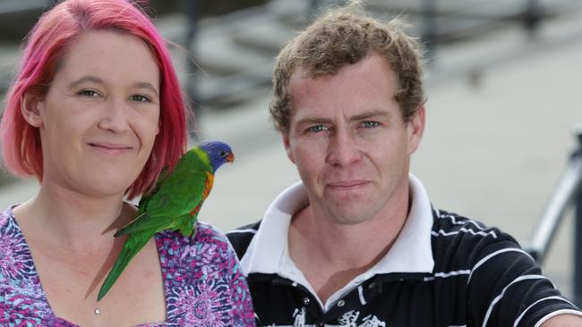 Hannah McLachlan and Trent Lovegrove with their own pet lorikeet Grace. Picture: Timothy Clapin