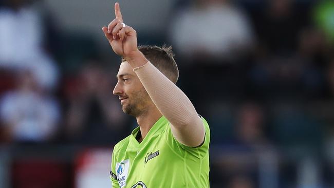 Spearhead Daniel Sams celebrates a wicket for Sydney Thunder.