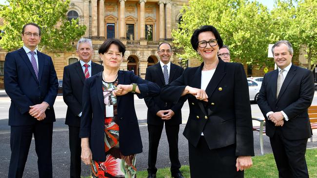 SA’s new Court of Appeal President, Justice Trish Kelly, is welcomed by Attorney-General Vickie Chapman with an elbow bump in front of her new team – Justices Chris Bleby, David Lovell, Sam Doyle and Mark Livesey. At the centre is Supreme Court Chief Justice Chris Kourakis. Picture: Mark Brake