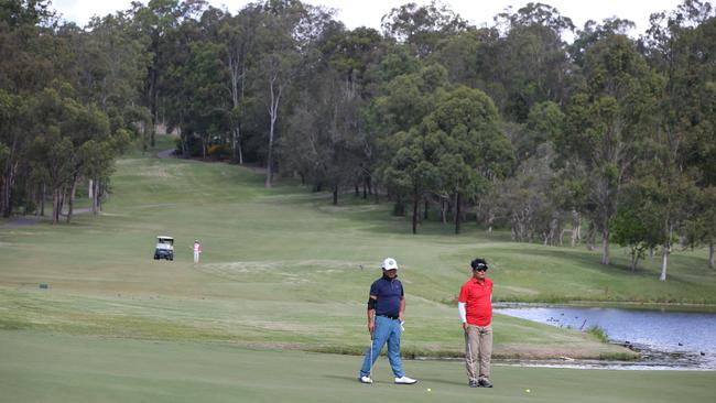 Golfers at Arundel Hills Country Club before it collapsed. Picture Glenn Hampson