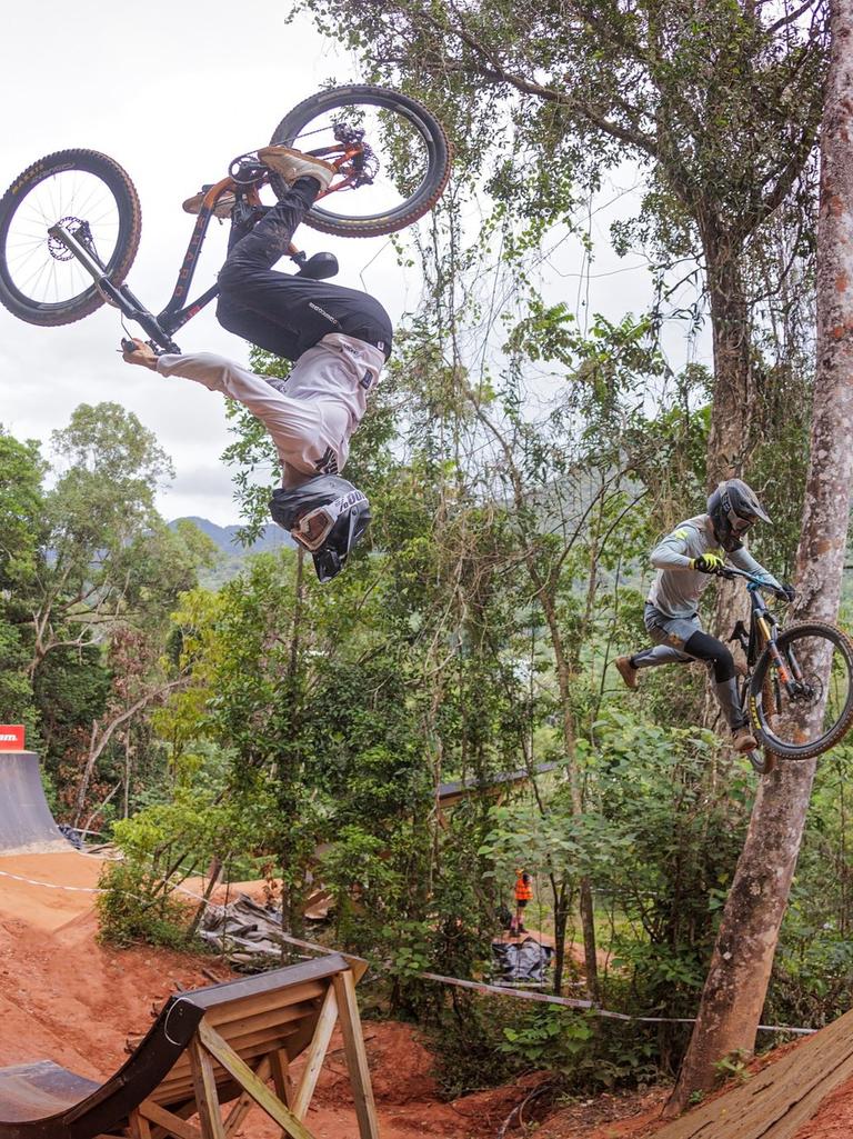 Jackson Frew (right) pulls off a trick on his way to a podium finish in the Speed n Style event at Crankworx Cairns 2024. Picture: Clint Trahan