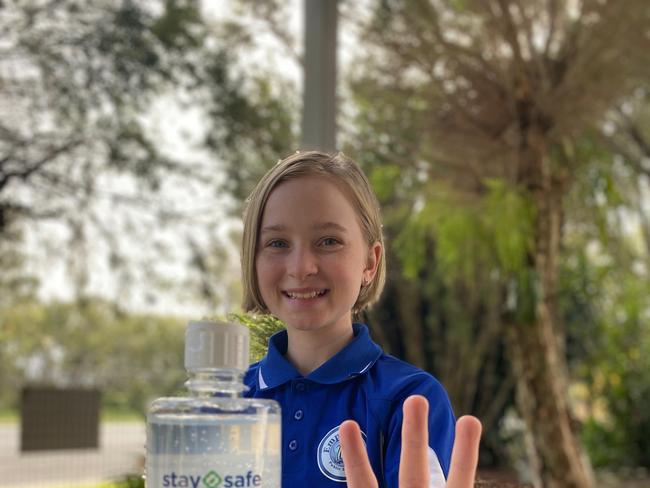 HAPPY HANDS. Matlida Dumesny of Empire Vale Public School appreciates the Sunshine Sugar Mill's generious gift of hygiene products.  Photo: Karen Rantissi