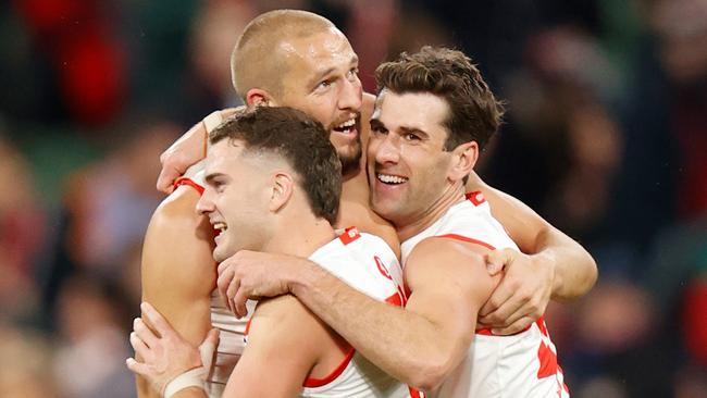 Tom Papley, Sam Reid and Robbie Fox celebrate during the Swans’ come-from-behind victory over Melbourne. Picture: Getty Images