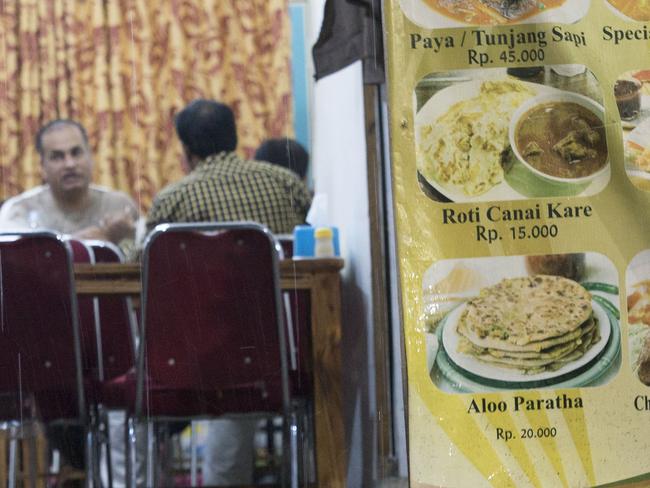 Asylum-seekers say this low-rent Pakistani restaurant in central Jakarta is where smugglers talk price and passage to Australia. Picture: Ardiles Rante/ News Corp Australia