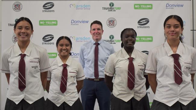 Some of the Marsden SHS Titans Cup schoolgirl players, alongside executive principal Andrew Peach.